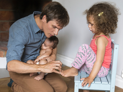 Man with a baby and girl (photo)