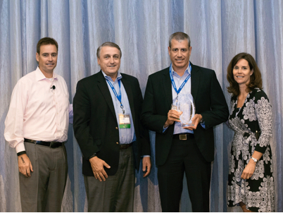 Stanton McComb, President of McKesson, Michael Feenan and Josh Renihan from SCA with Joan Eliasek, Vice President of McKesson at the award ceremony. (photo)