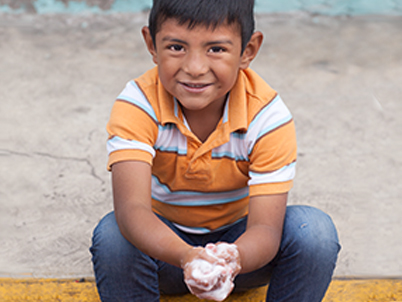 Boy washing hands (photo)